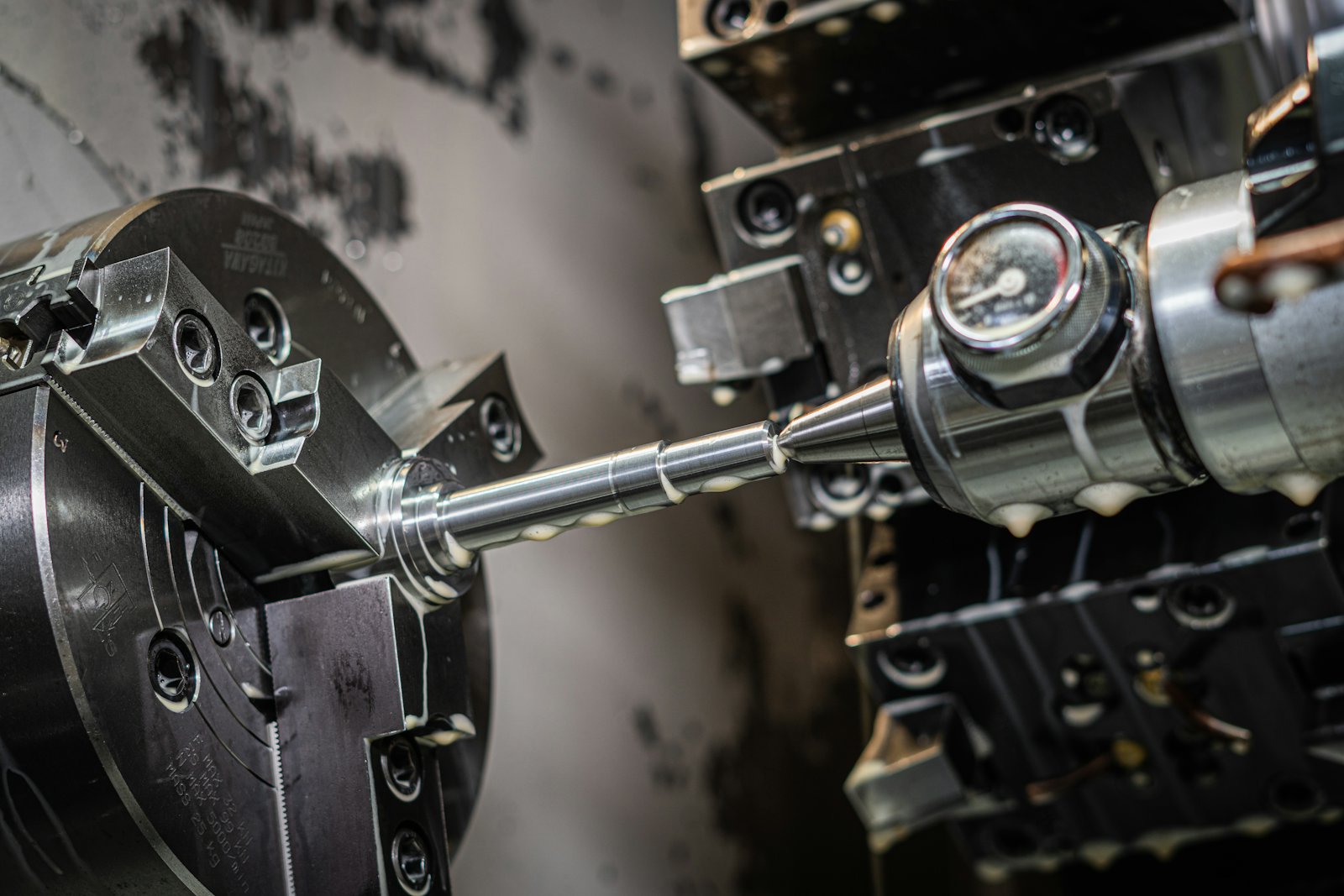 CNC lathe chuck holding a metal workpiece